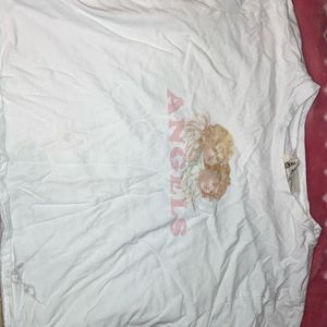 white angel crop top with a quote from raphaelle on the back